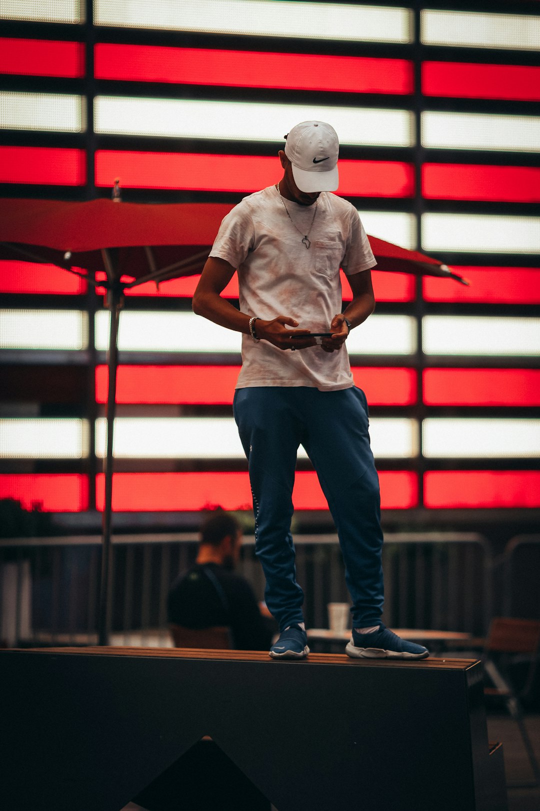 man in white cap and blue denim jeans