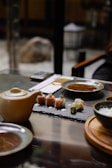 A serene dining setting with sushi and sake, highlighting a premium experience.