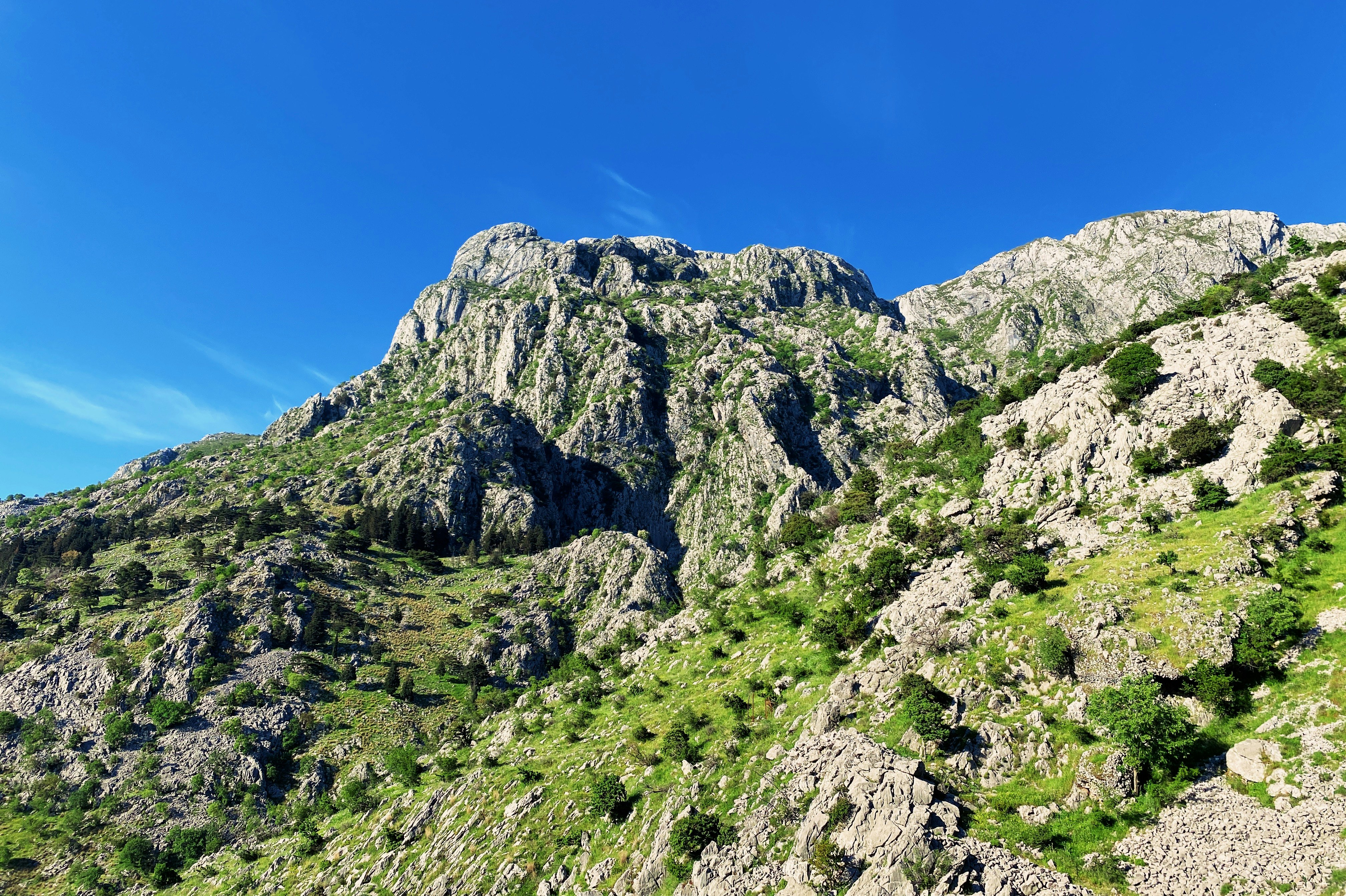 green and gray mountain under blue sky during daytime