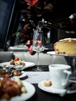 white ceramic mug on white ceramic plate