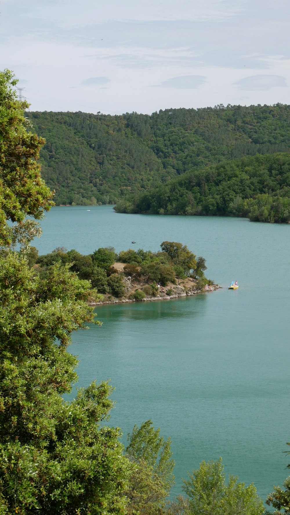 person riding on boat on lake during daytime