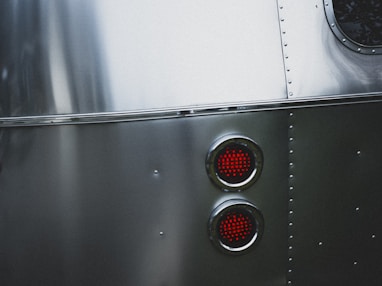 silver and red elevator button