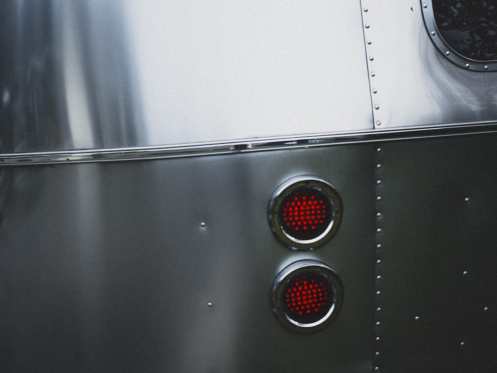 silver and red elevator button