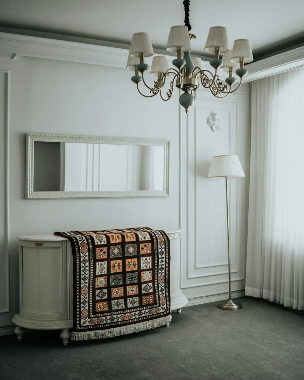 brown and black ottoman beside white wooden door