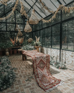 brown wicker chairs and table with red and white table cloth