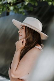 woman in white hat and white tank top