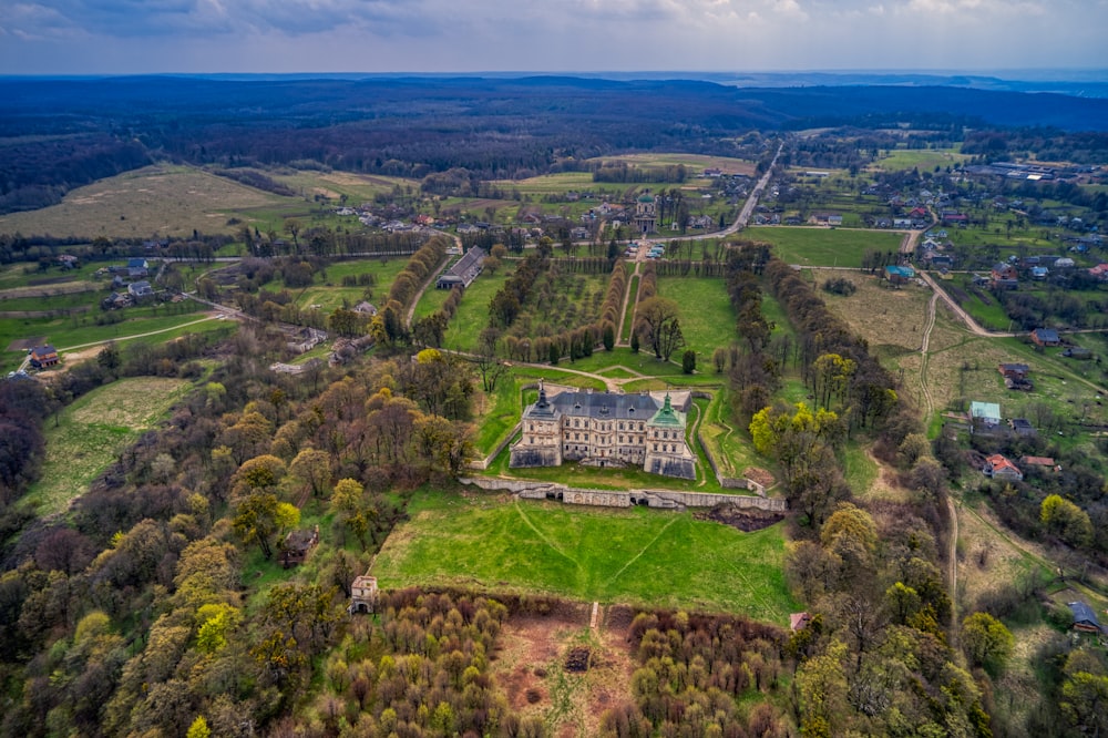 aerial view of green trees and green grass field during daytime