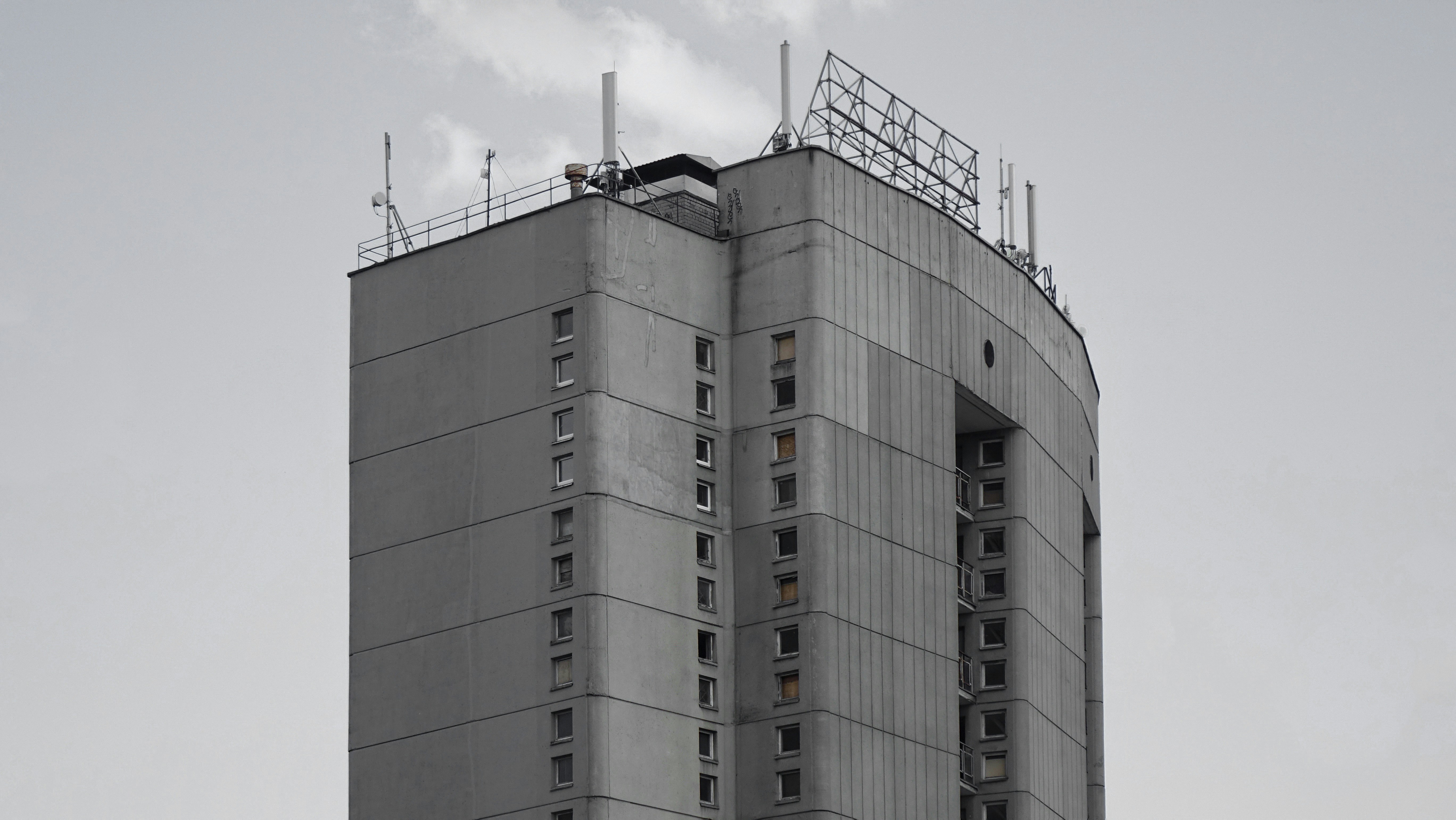 white concrete building under white sky during daytime