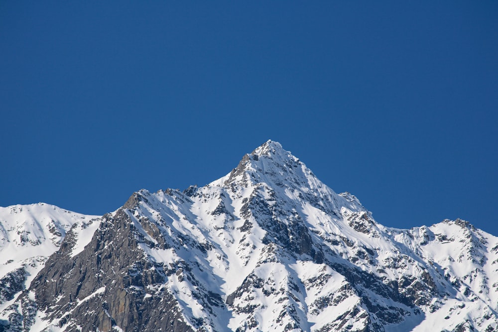 snow covered mountain under blue sky during daytime