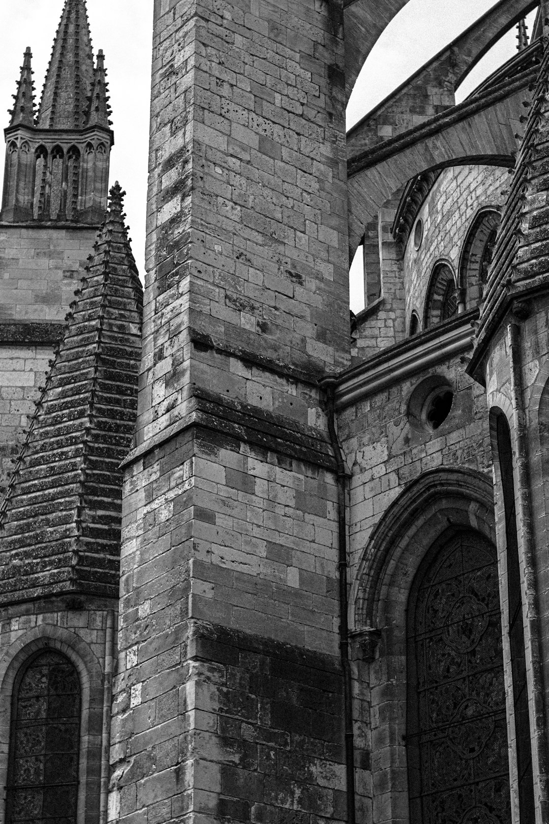 grayscale photo of brick building