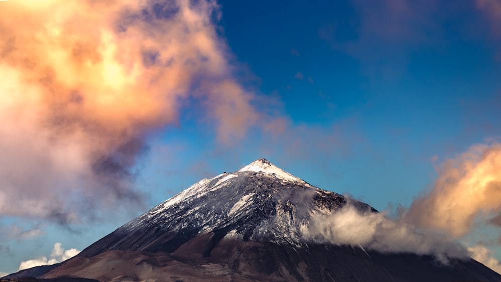 white and black mountain under blue sky during daytime