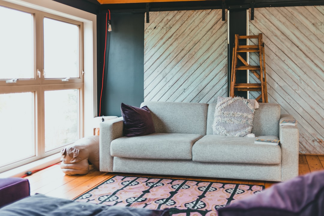 gray sofa with throw pillows