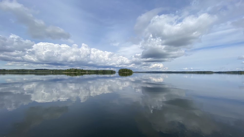 body of water under blue sky