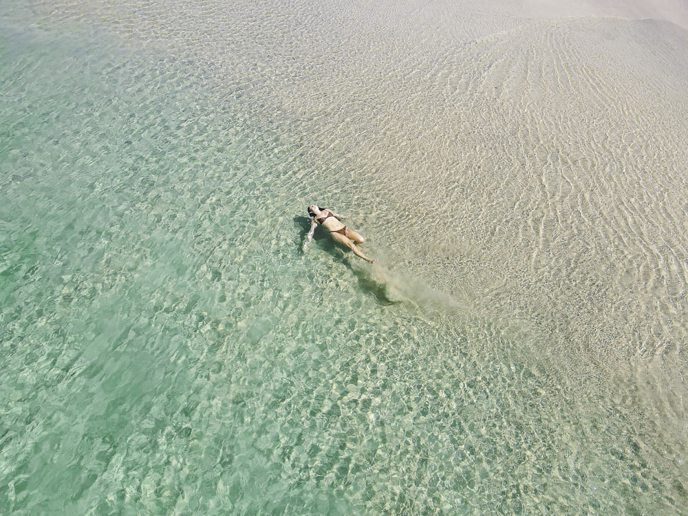 person surfing on sea during daytime