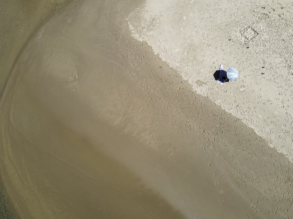 aerial view of white sand beach during daytime