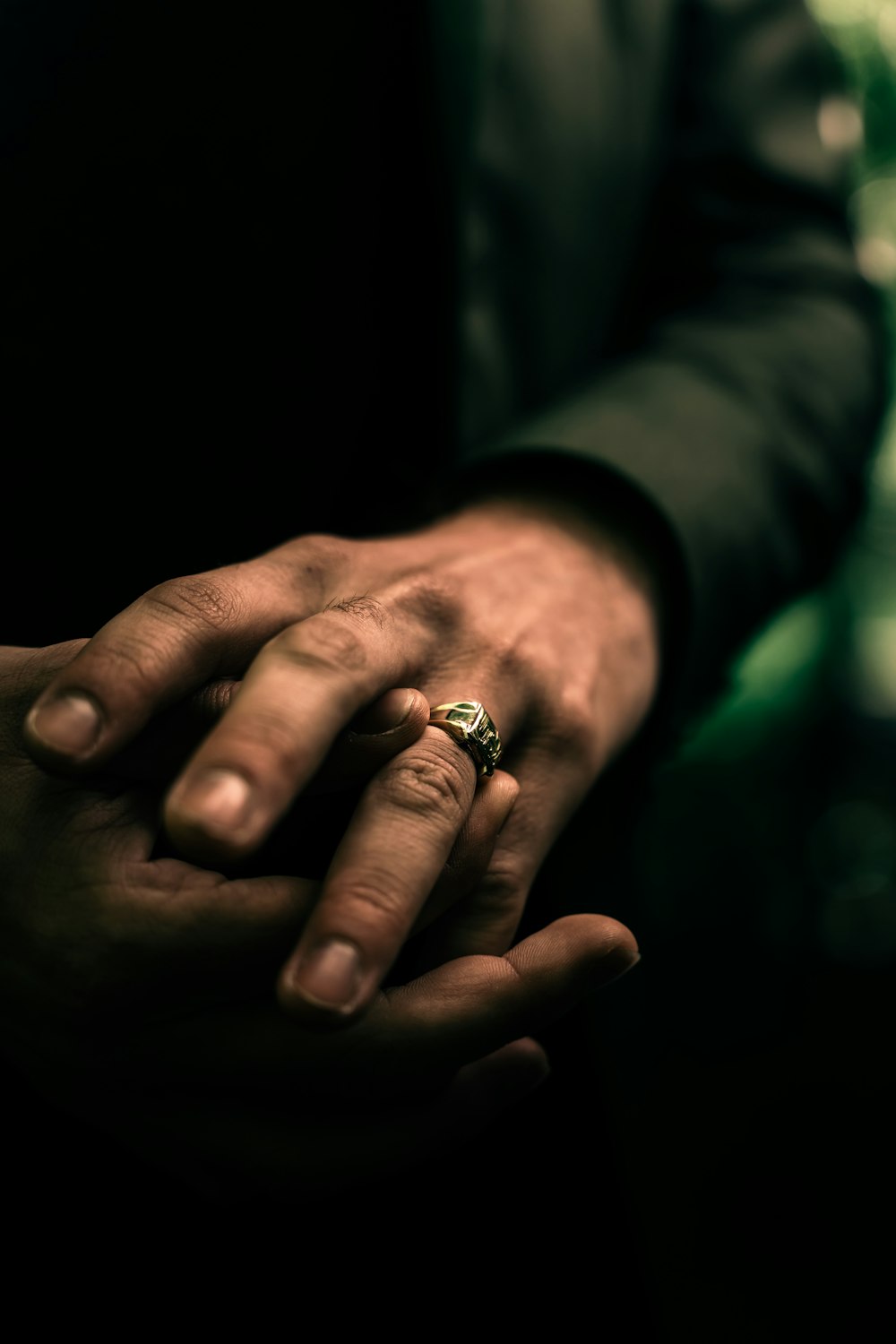 person wearing gold diamond ring