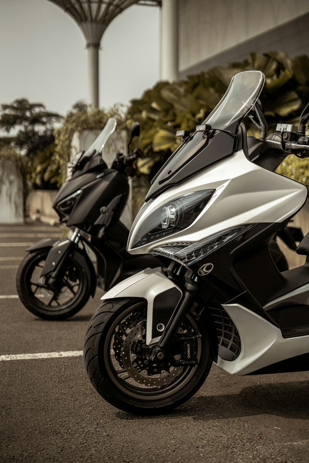 white and black sports bike on road during daytime