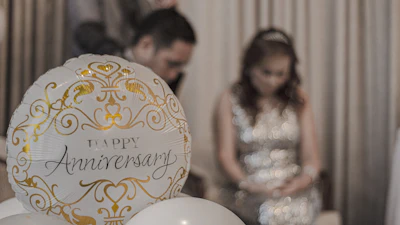 woman in white sleeveless dress sitting on chair