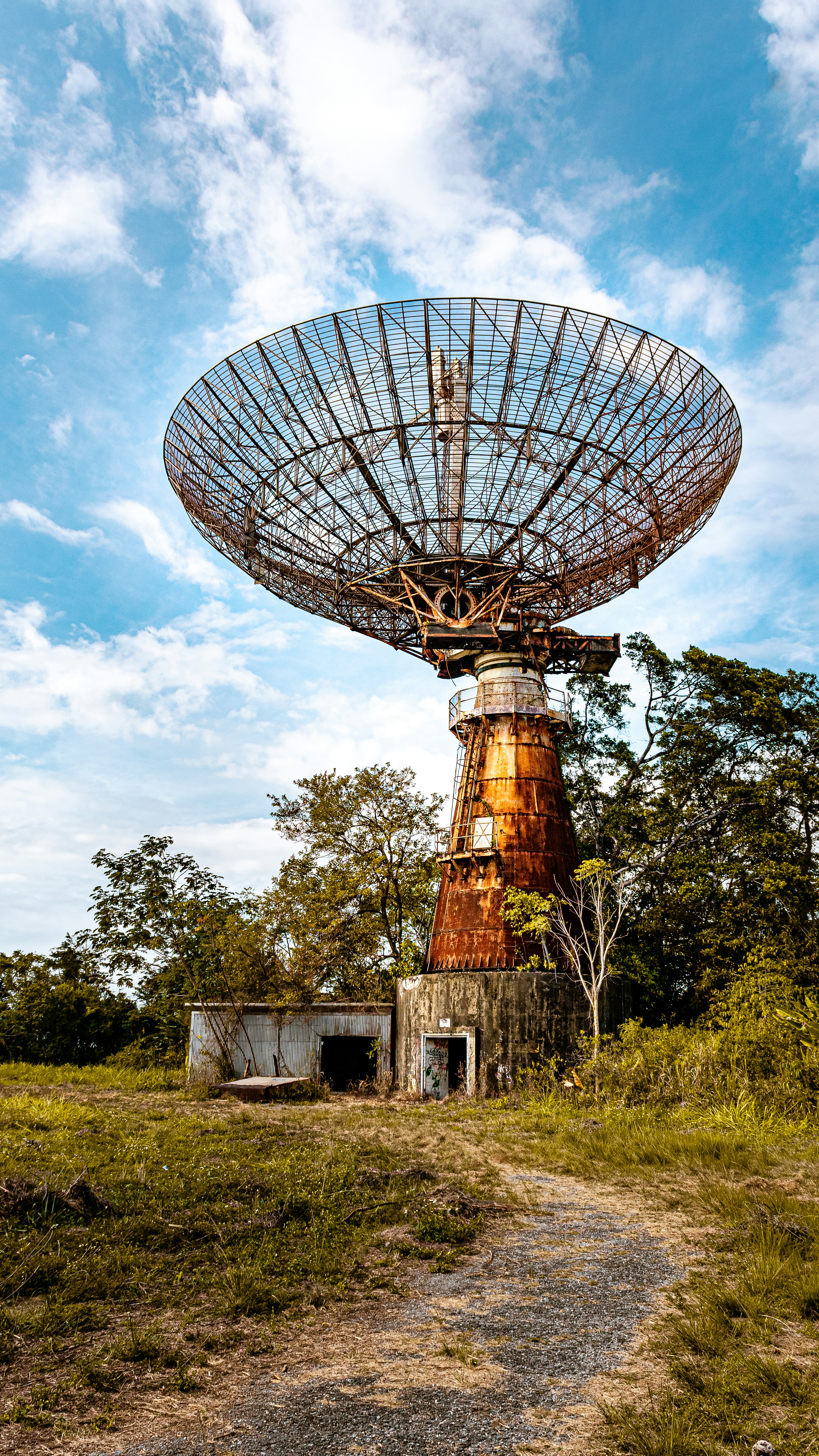 brown and gray windmill under cloudy sky during daytime