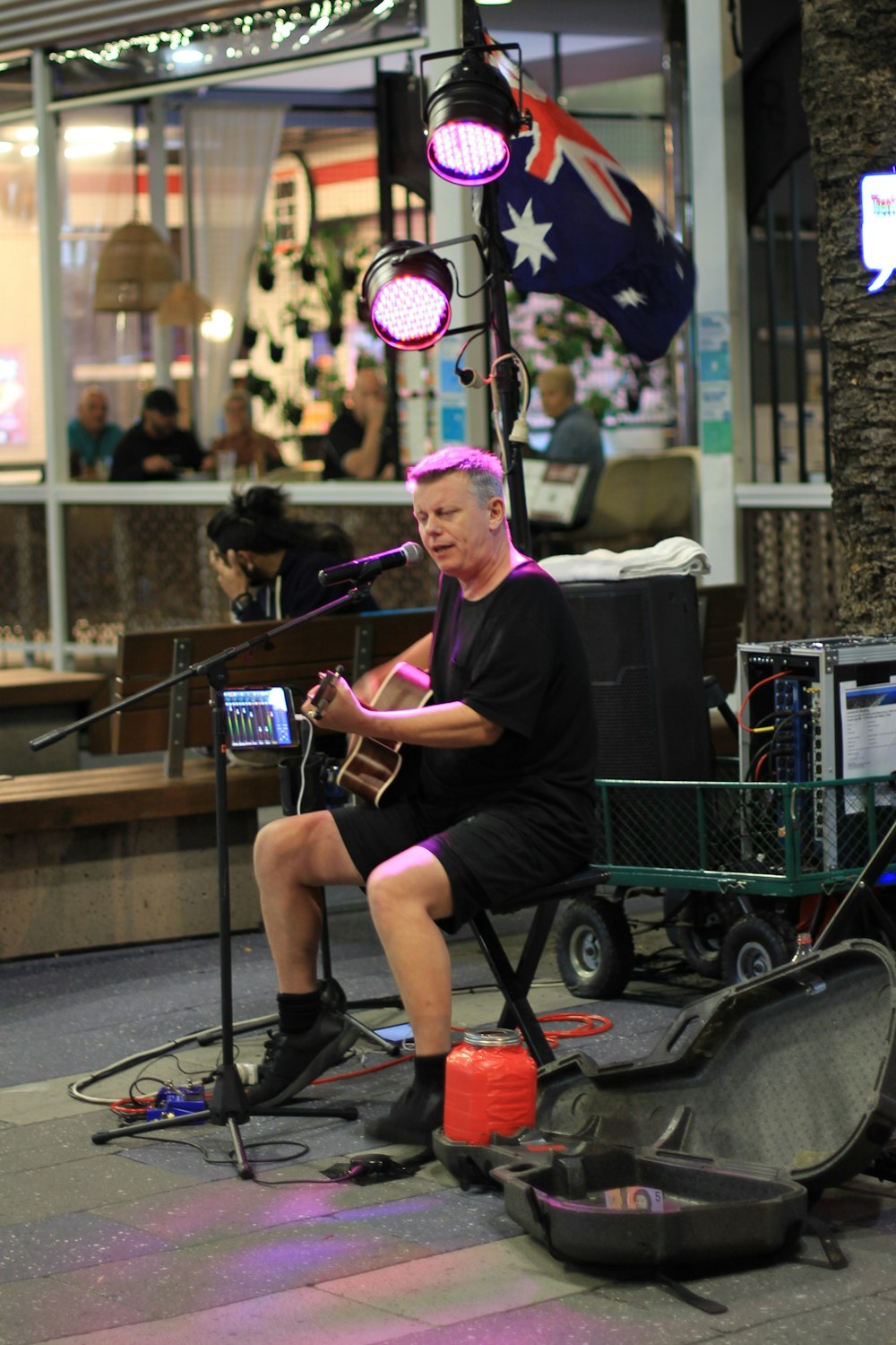 man in black crew neck t-shirt sitting on black wheel chair