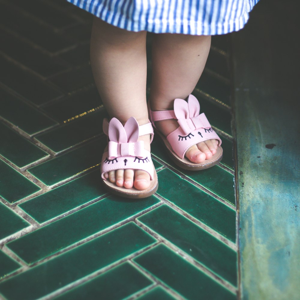 woman in white and blue stripe skirt and white sandals