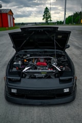 black bmw m 3 parked on parking lot during daytime