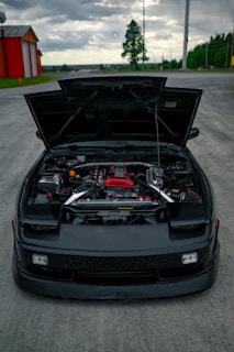 black bmw m 3 parked on parking lot during daytime