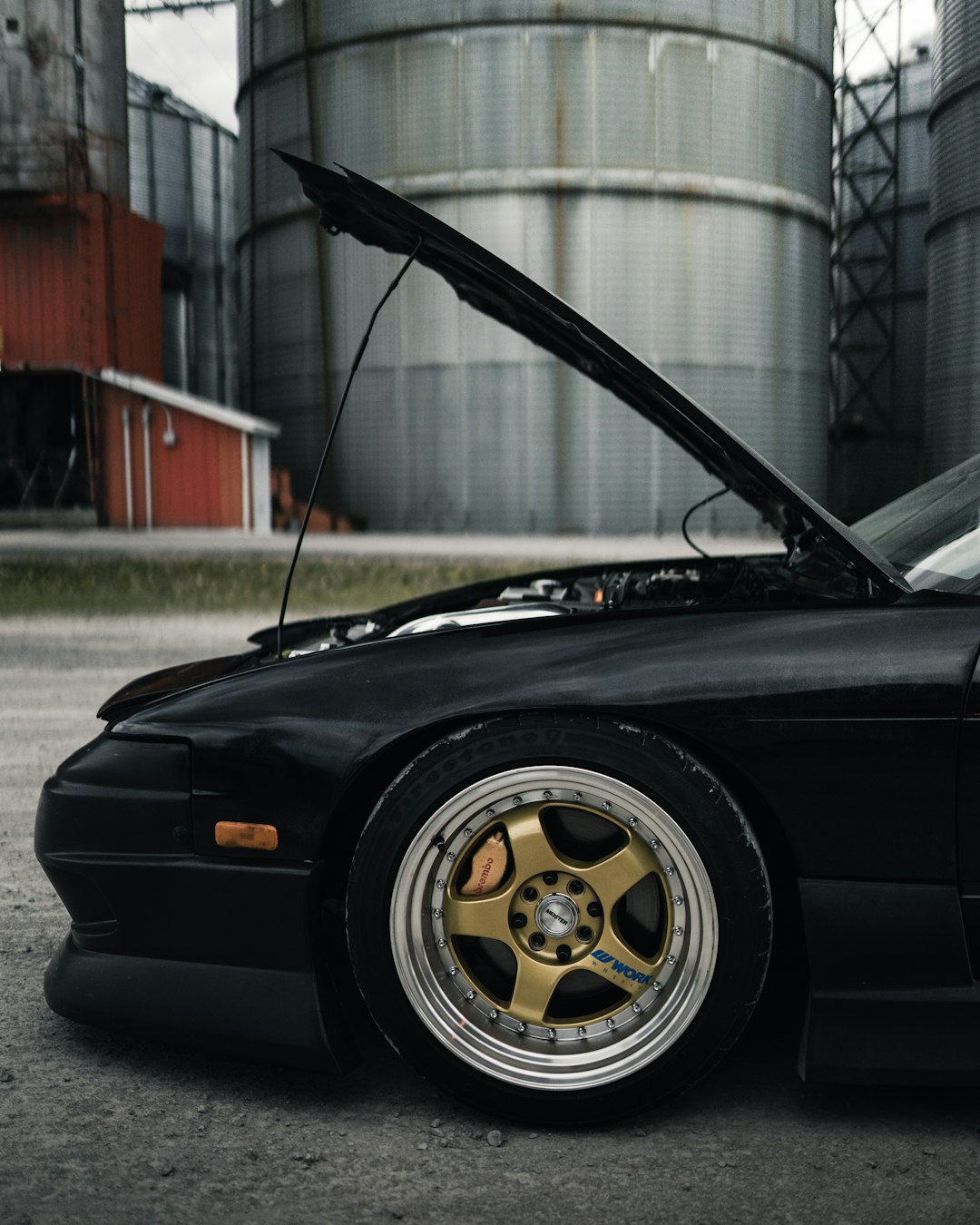 black porsche 911 parked on gray concrete road during daytime