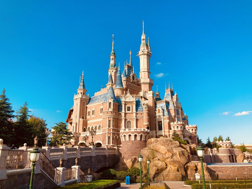 brown and white concrete castle under blue sky during daytime