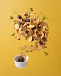 brown nuts on white ceramic bowl
