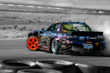 An action-packed scene from a fast-paced racing game with sleek cars zooming past.