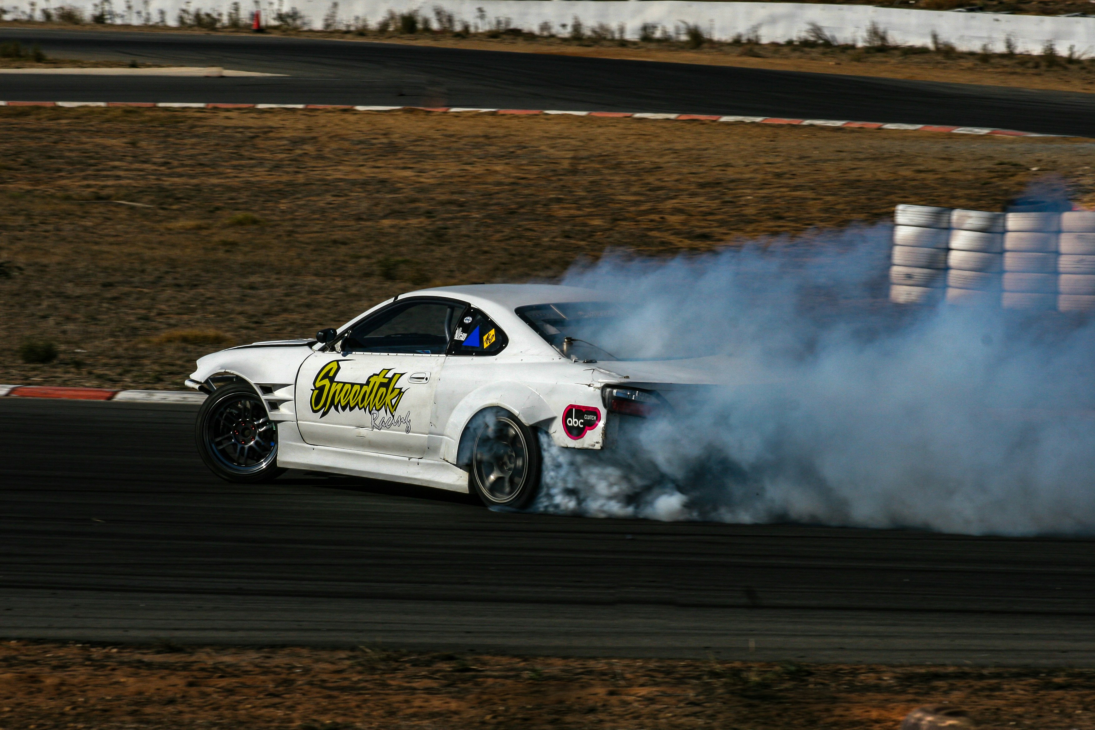 white porsche 911 on race track