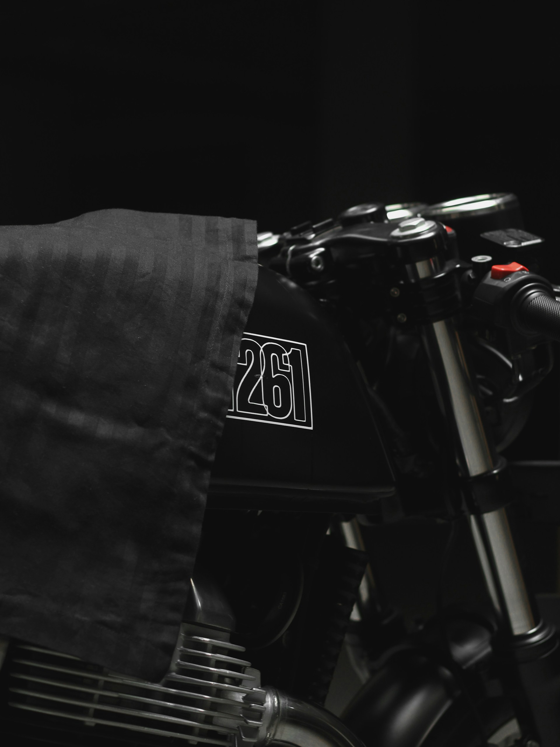 black and gray motorcycle with black background