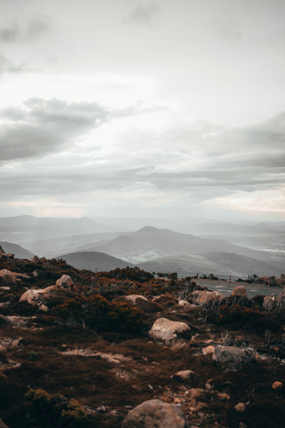 brown and black mountains under white clouds during daytime