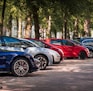 blue and red sports car on road during daytime