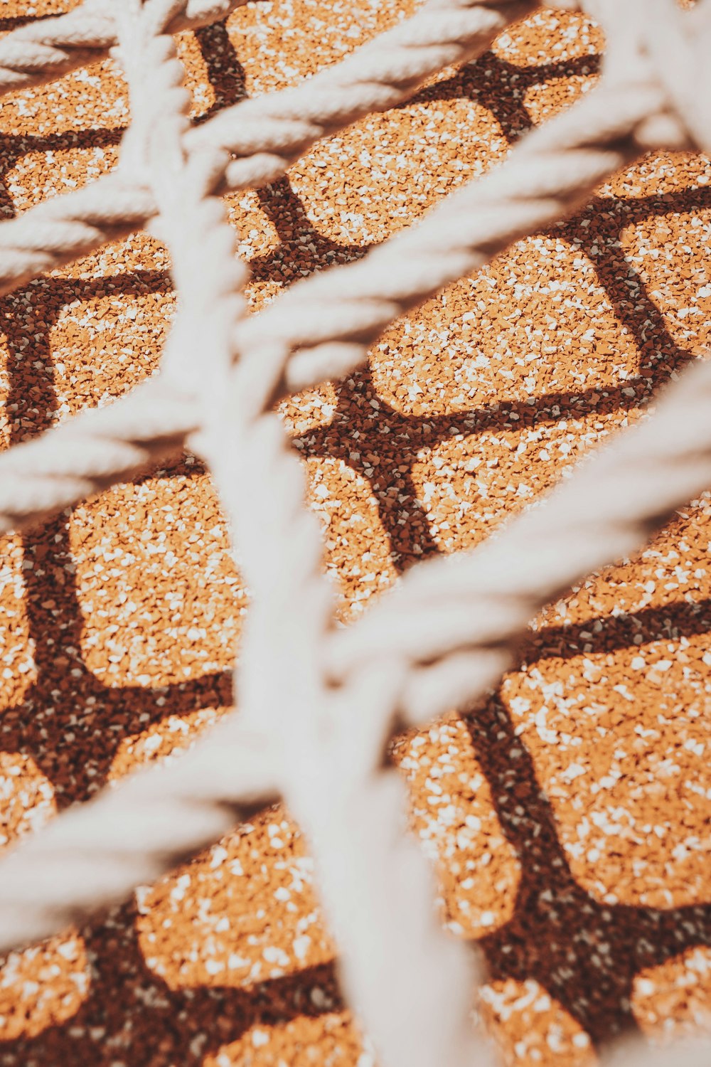 white metal fence on brown and black floor