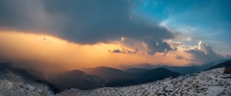 A panoramic view of a dramatic mountain landscape with vivid colors