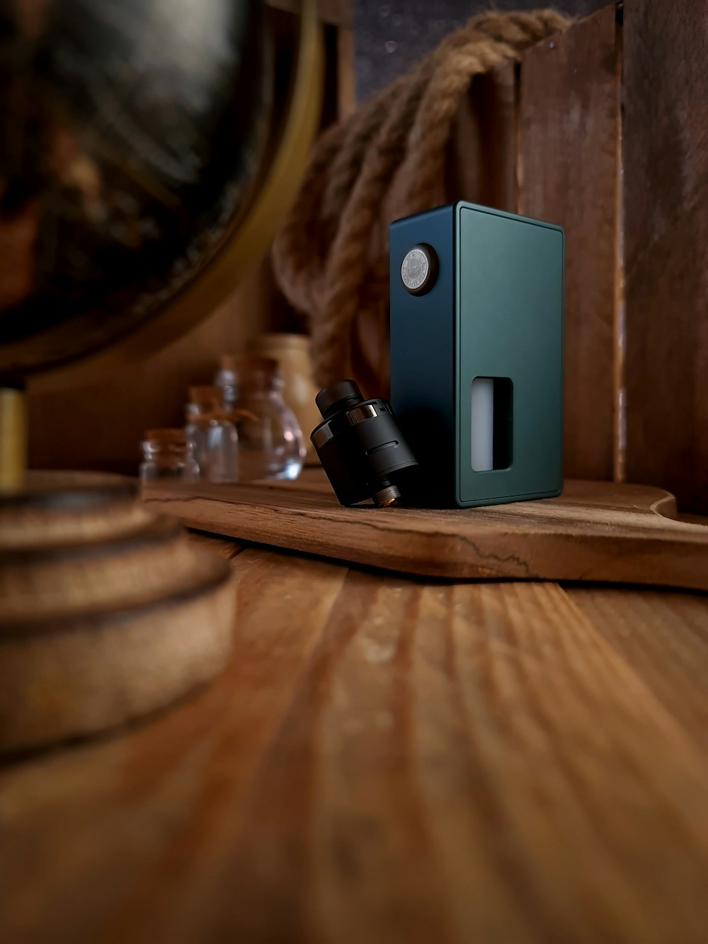 black and gray speaker on brown wooden table