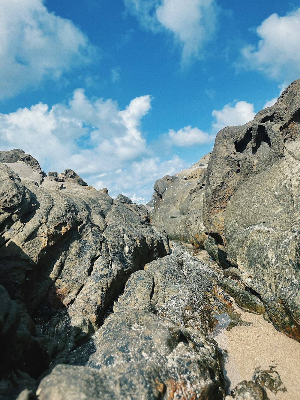 gray rocky mountain under blue sky during daytime