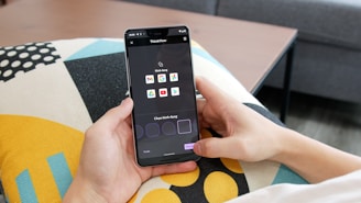 person holding black android smartphone