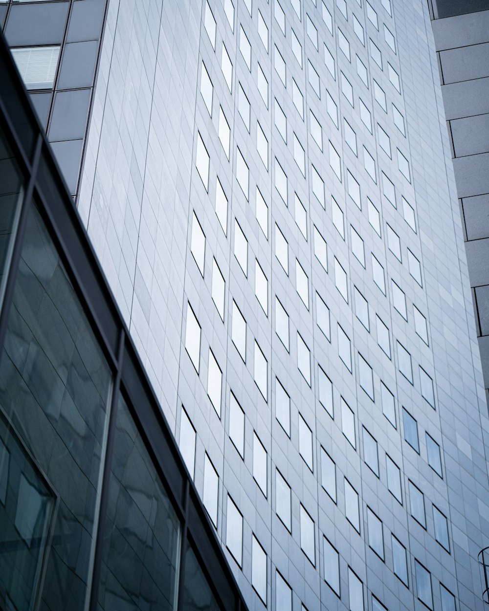 white and black glass walled high rise building