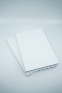 white printer paper on white surface