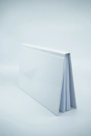 Close-up of the premium hardcover book with crisp black typography on a white background.