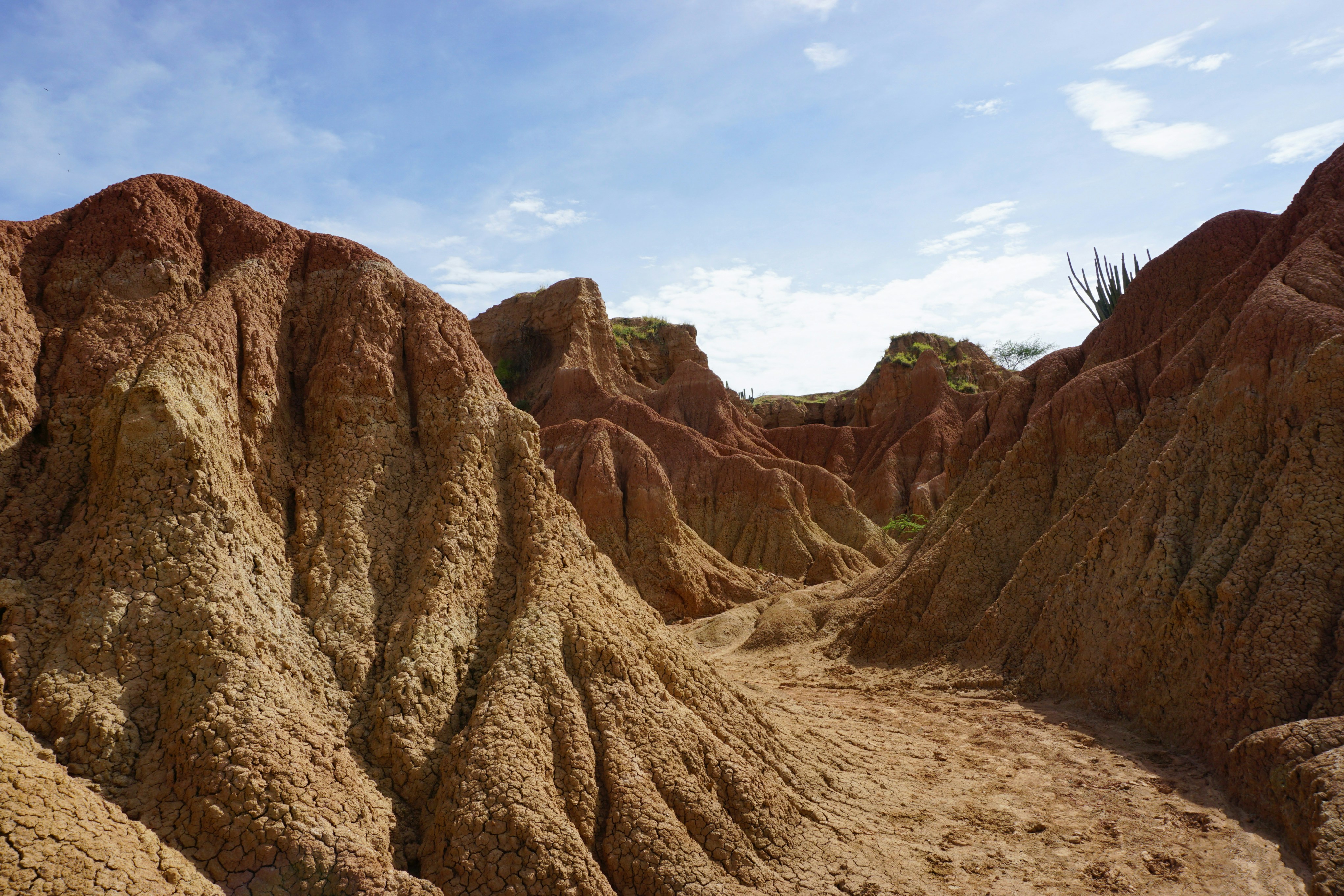 brown rocky mountain under blue sky during daytime, Impressive desert hills of Tatacoa Desert, Colombia.