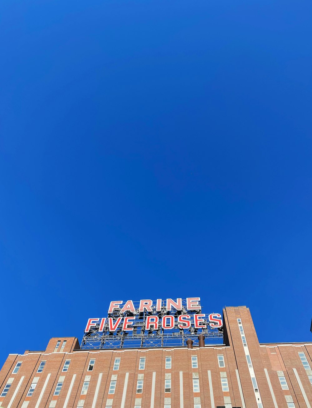 brown concrete building under blue sky during daytime