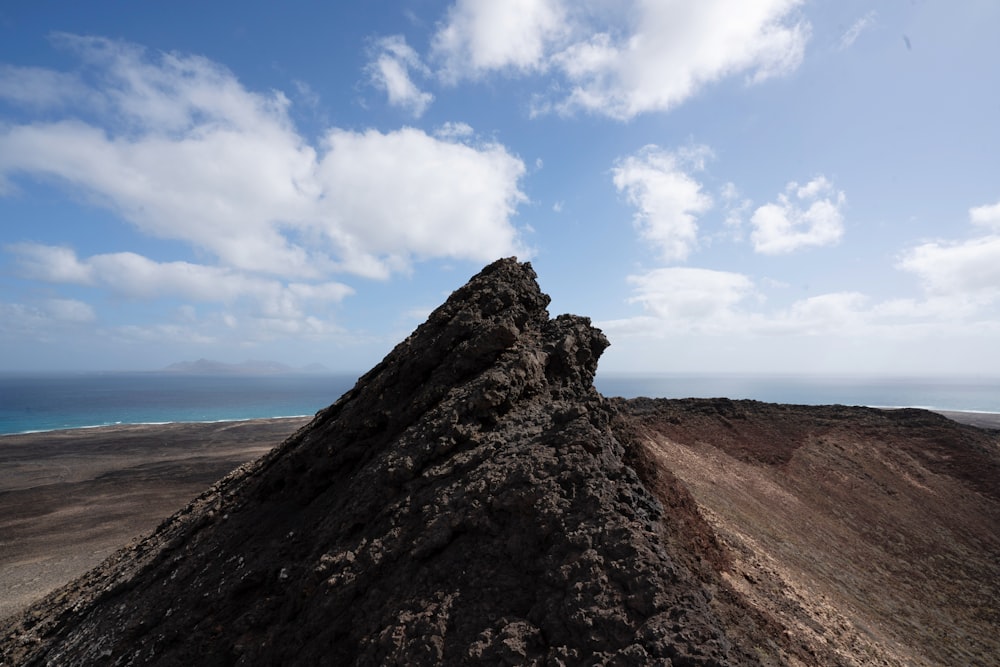 brown mountain under blue sky during daytime