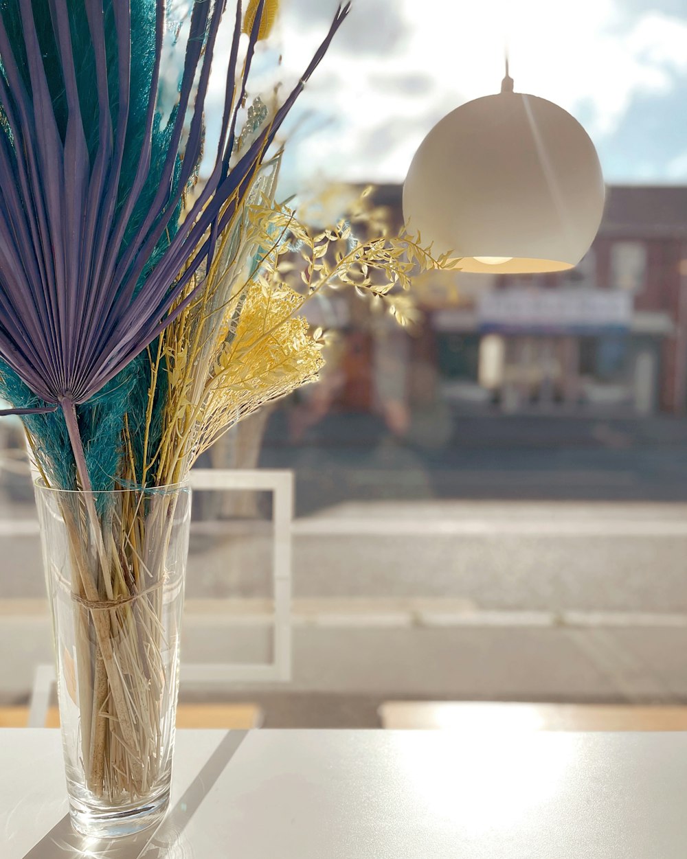 blue and white umbrella with yellow flowers