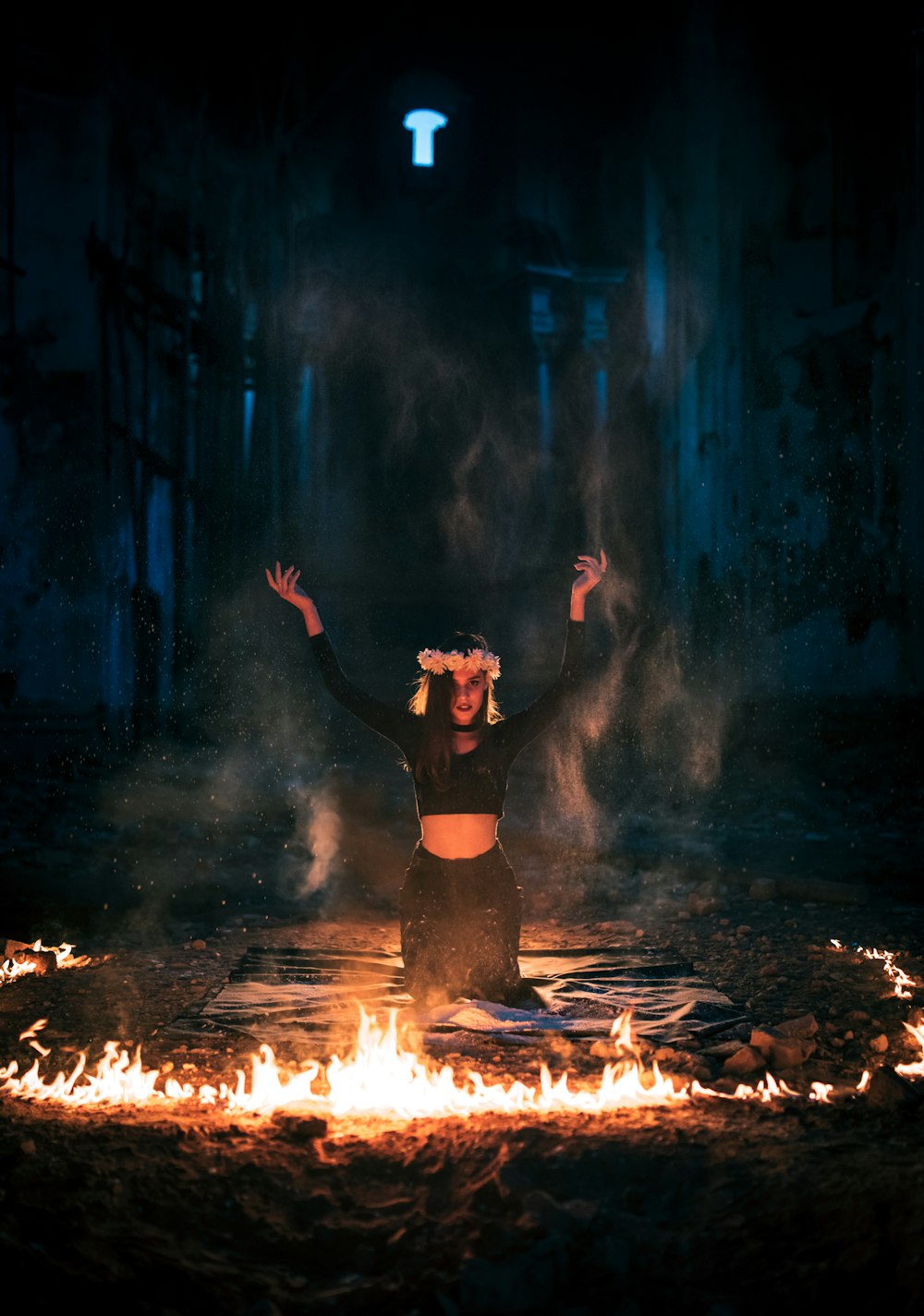 woman in black dress standing on fire