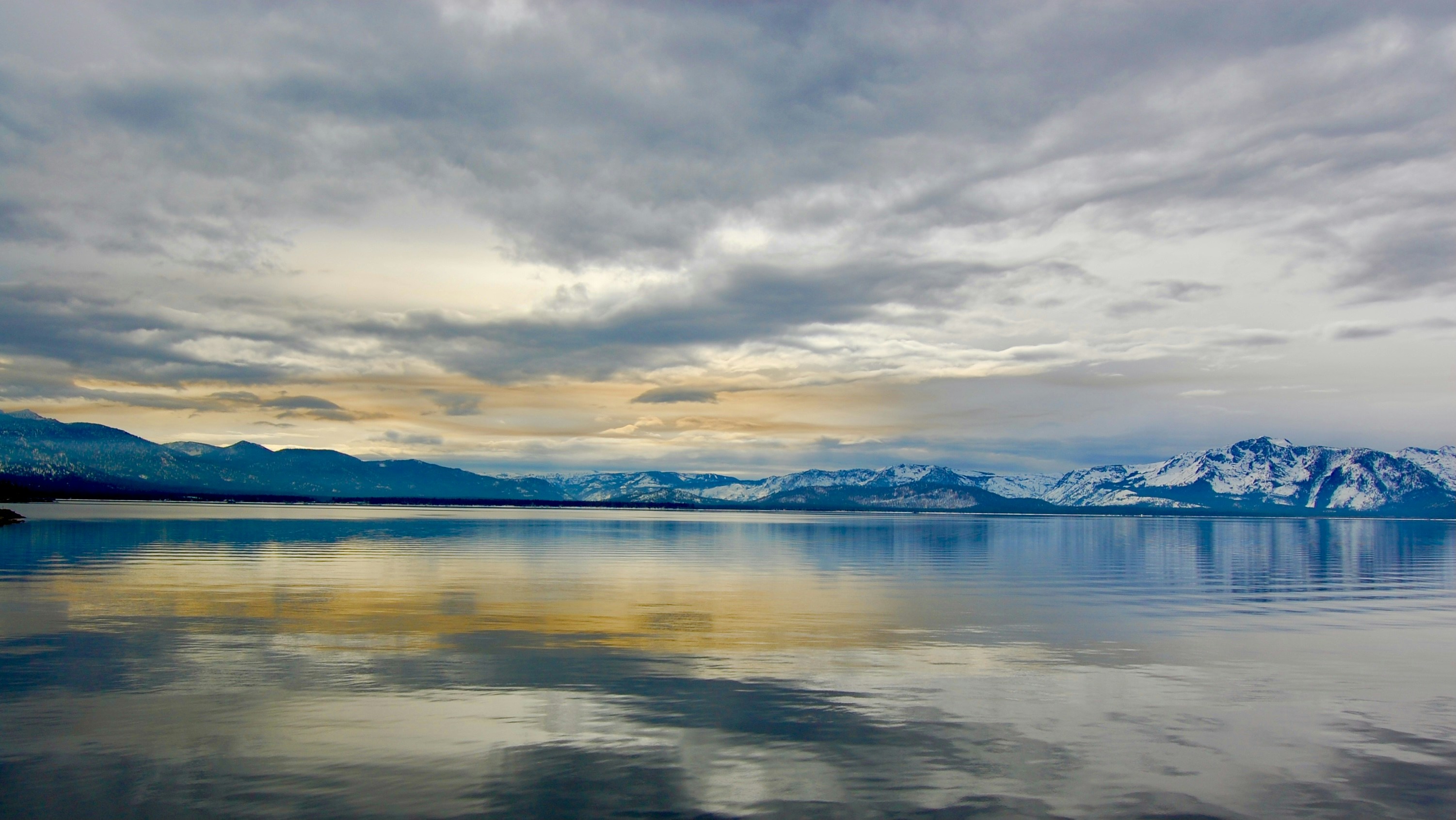body of water under cloudy sky during daytime, 