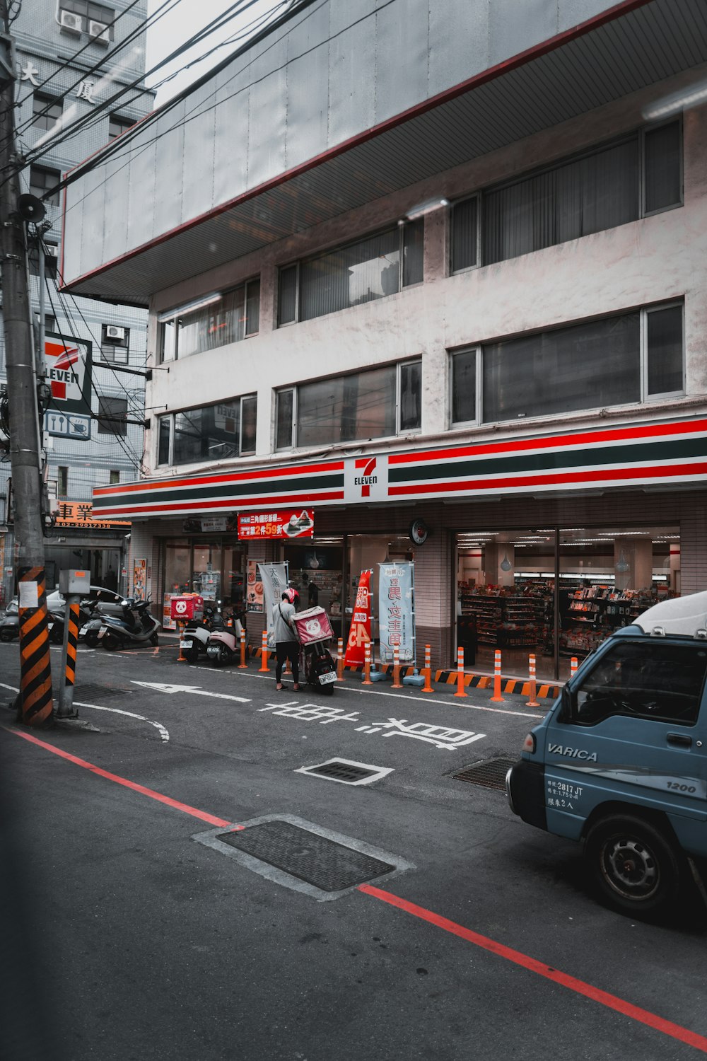 cars parked in front of store during daytime